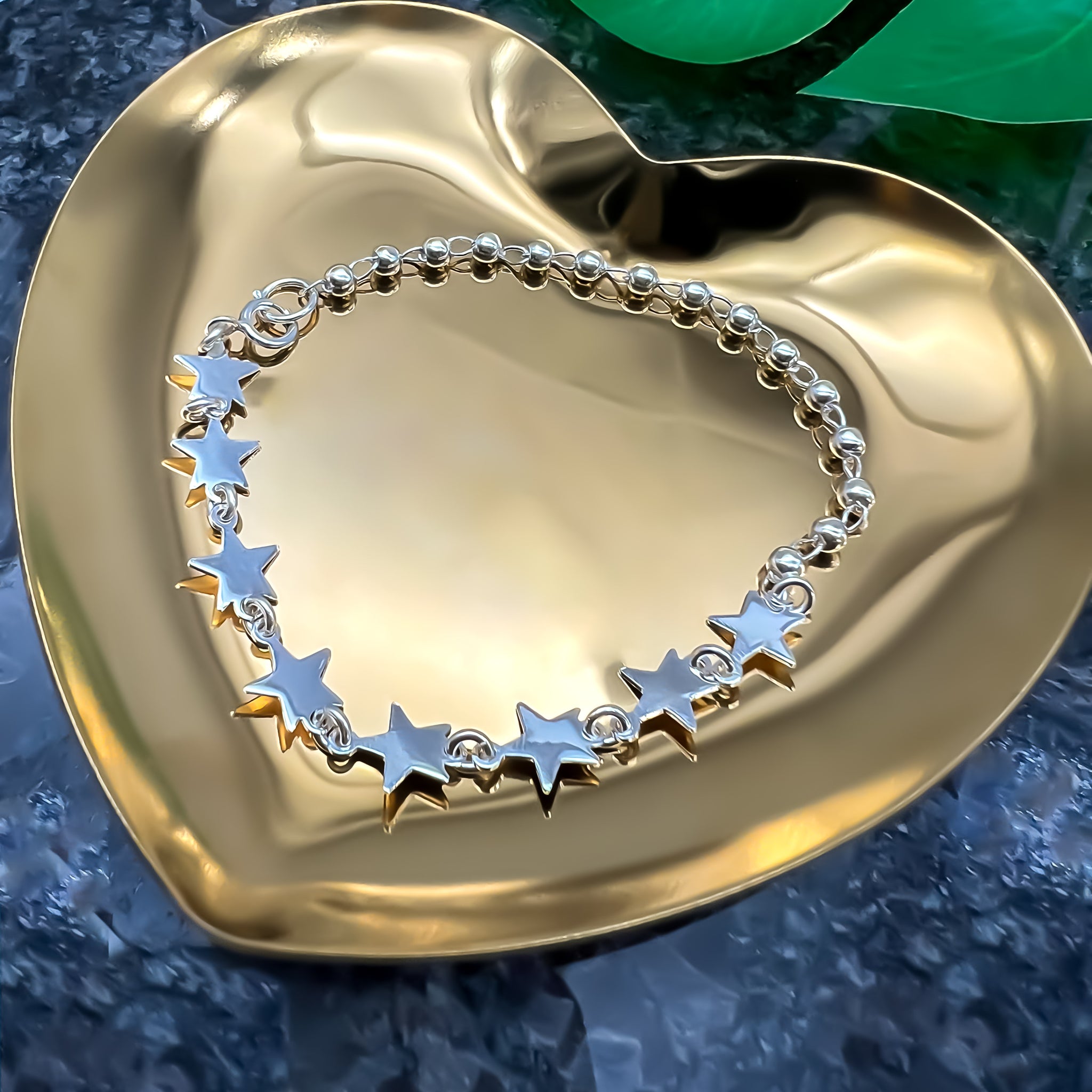 Pulsera de plata bolitas y estrellas