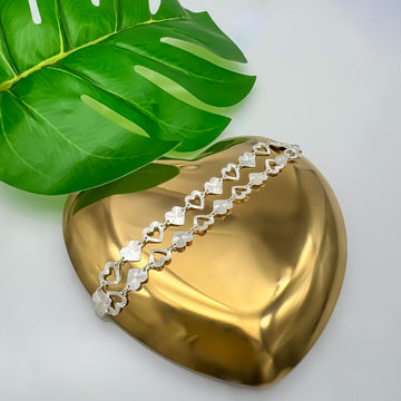 Pulsera de plata con corazones diamantados
