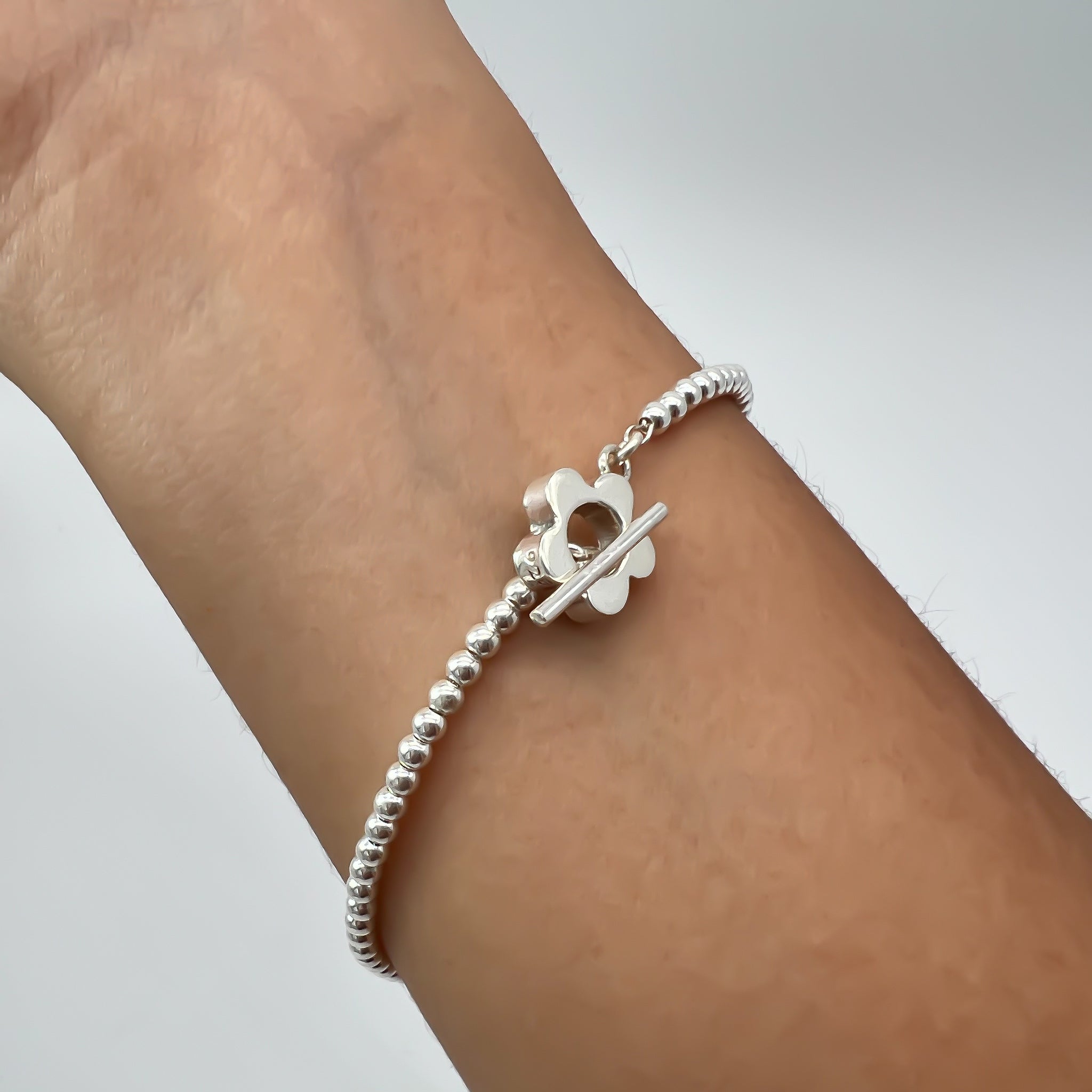 Pulsera de plata cuentas con florecita